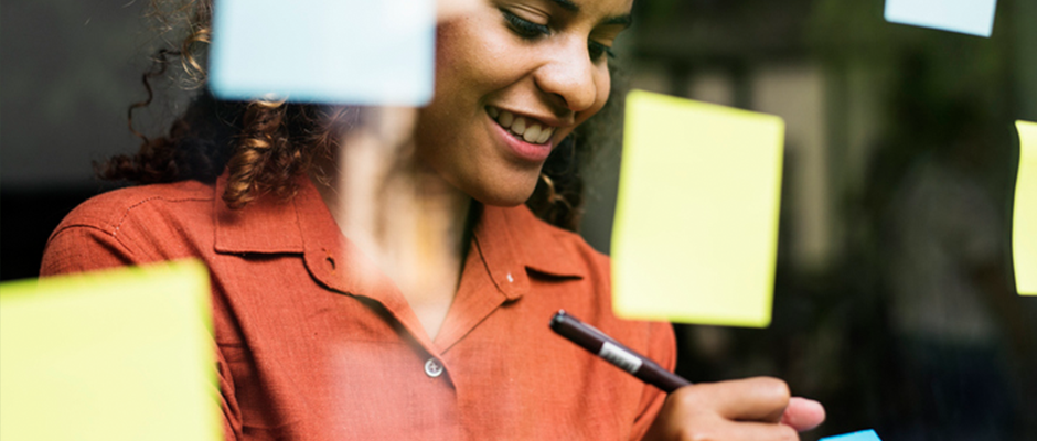 Woman planning on sticky notes