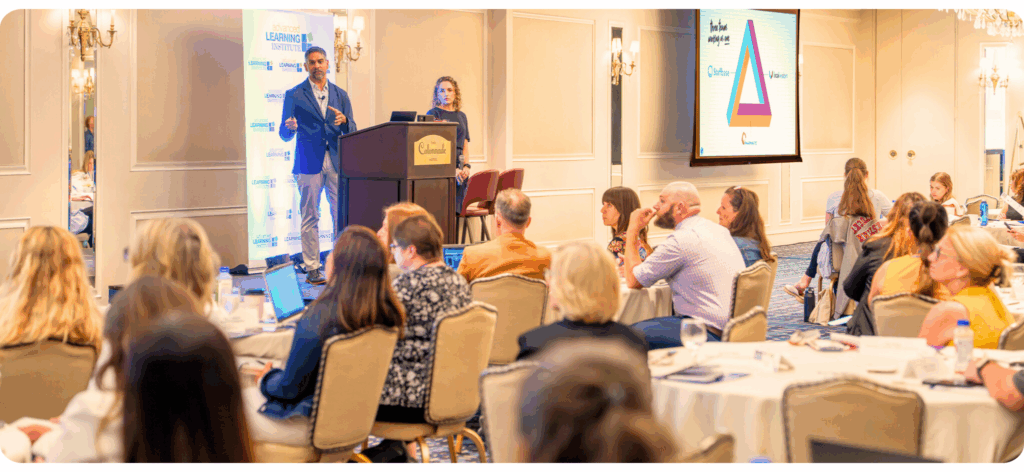 Teresa Palase and Pinaki Kathiari presenting on stage