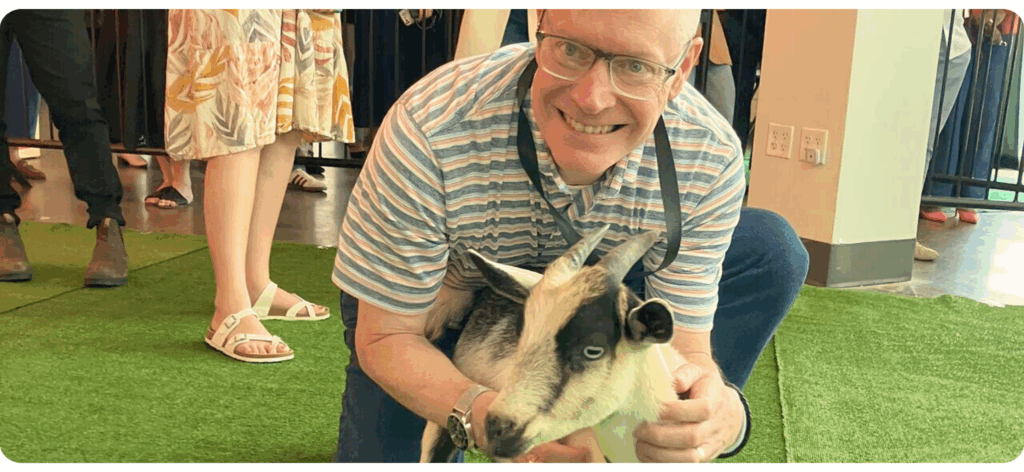 Rich Dome with a goat at the Workshop Brightside conference 2025